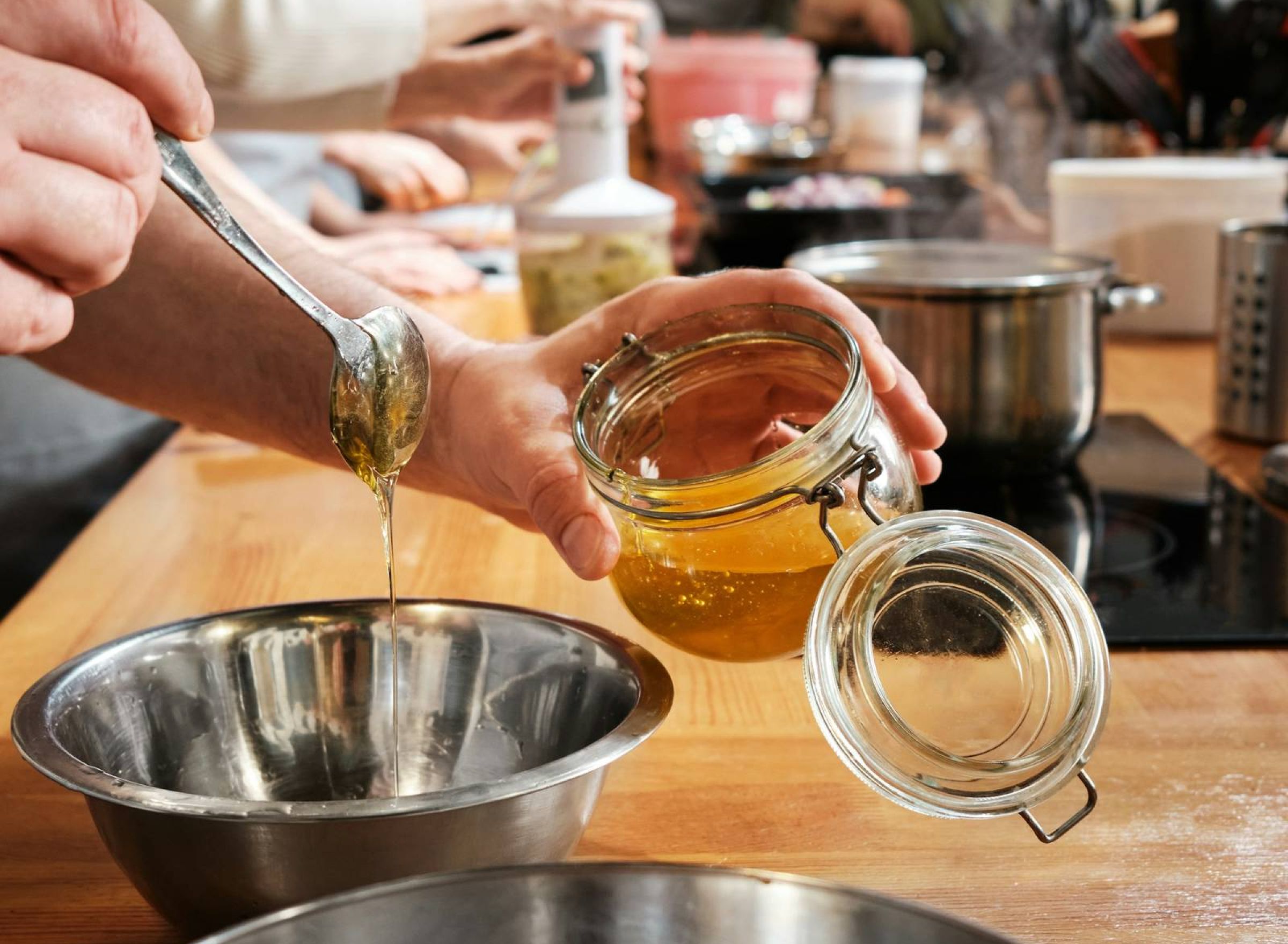 Monteverde in San Antonio, TX with a social kitchen and a group of people making a gourmet meal together